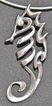 designer sterling silver seahorse pendant on grey background
